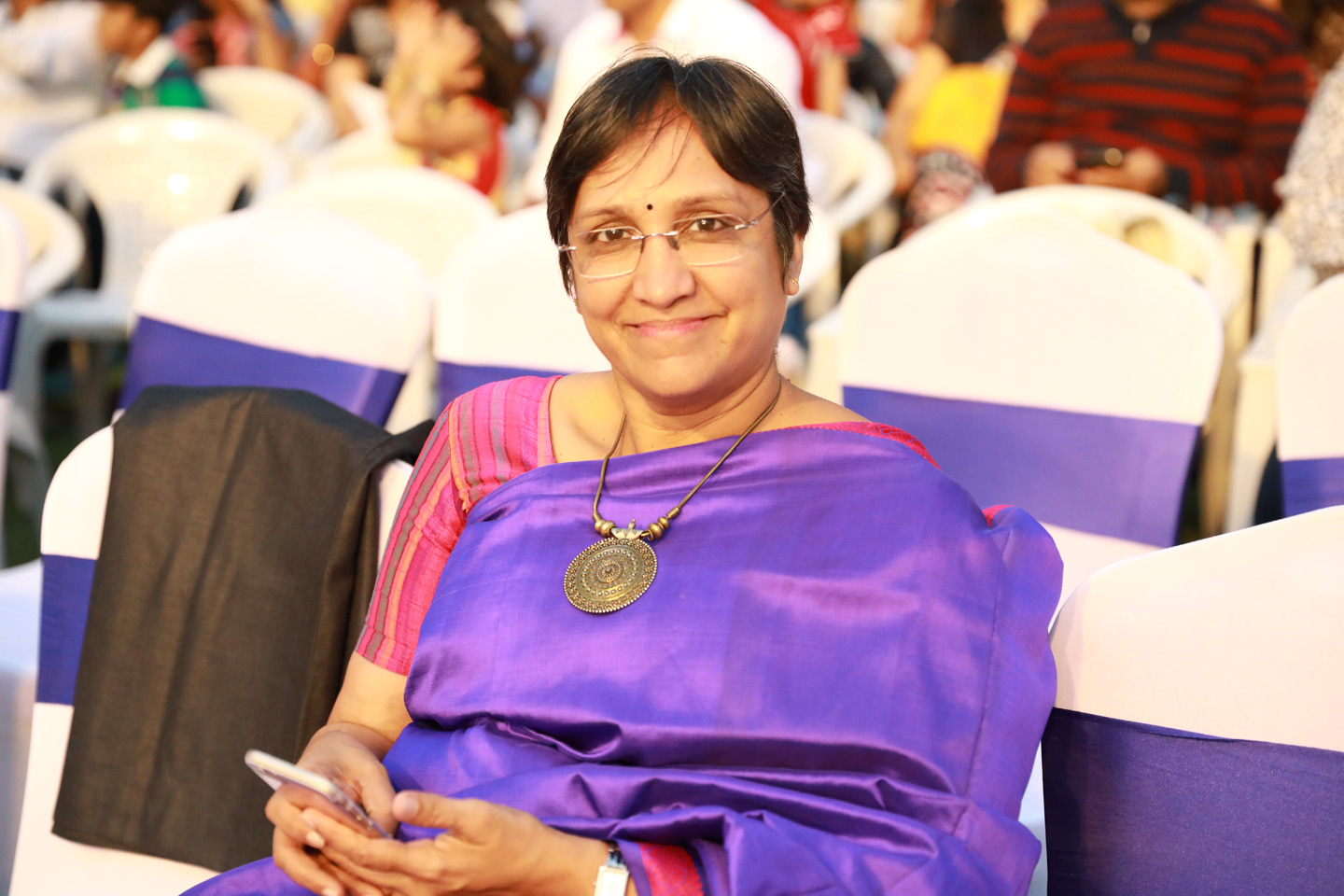 Prameela Kalive seated at an event